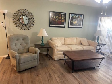 Under contract-accepting backup offers. Clean & Immaculate on Highland Lakes Executive Golf Course in Florida - for sale on GolfHomes.com, golf home, golf lot