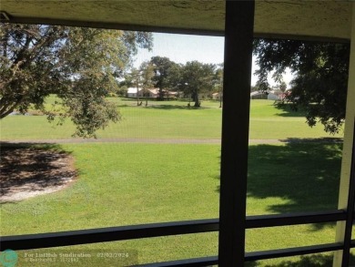 Laminated floor , tile. Golf view, 2nd floor, large balcony on Woodmont Country Club in Florida - for sale on GolfHomes.com, golf home, golf lot