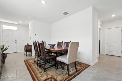 Discover the exceptional value of this pristine 2023 DR Horton on Halifax Plantation Golf Club in Florida - for sale on GolfHomes.com, golf home, golf lot