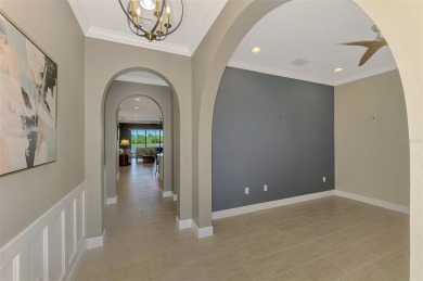 Stunning Waterfront WCI Grand Cayman in Sarasota National Lake on Sarasota National Golf Club in Florida - for sale on GolfHomes.com, golf home, golf lot
