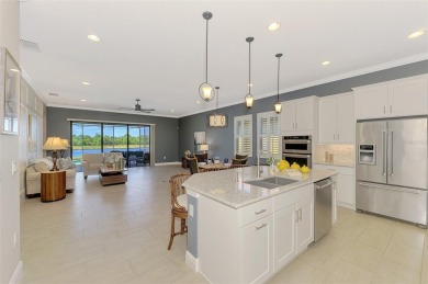 Stunning Waterfront WCI Grand Cayman in Sarasota National Lake on Sarasota National Golf Club in Florida - for sale on GolfHomes.com, golf home, golf lot