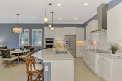 Stunning Waterfront WCI Grand Cayman in Sarasota National Lake on Sarasota National Golf Club in Florida - for sale on GolfHomes.com, golf home, golf lot