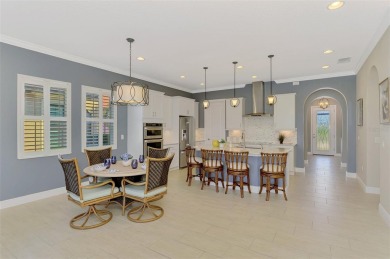 Stunning Waterfront WCI Grand Cayman in Sarasota National Lake on Sarasota National Golf Club in Florida - for sale on GolfHomes.com, golf home, golf lot