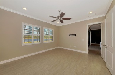 Stunning Waterfront WCI Grand Cayman in Sarasota National Lake on Sarasota National Golf Club in Florida - for sale on GolfHomes.com, golf home, golf lot