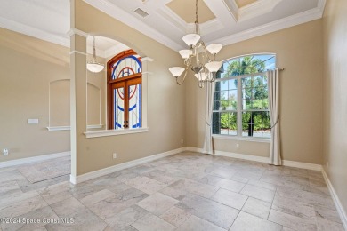 This stunning executive home exudes modern elegance and boasts on Baytree National Golf Links in Florida - for sale on GolfHomes.com, golf home, golf lot