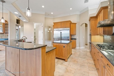 This stunning executive home exudes modern elegance and boasts on Baytree National Golf Links in Florida - for sale on GolfHomes.com, golf home, golf lot