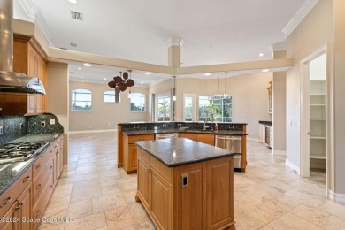 This stunning executive home exudes modern elegance and boasts on Baytree National Golf Links in Florida - for sale on GolfHomes.com, golf home, golf lot