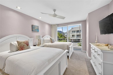 Morning light floods the beautiful window lined sunroom of this on Captiva Island Golf Club in Florida - for sale on GolfHomes.com, golf home, golf lot
