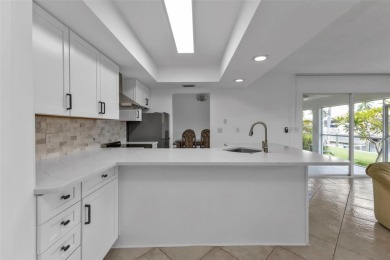 A true boater's dream, nestled just steps from the open waters on Saint Andrews South Golf Club in Florida - for sale on GolfHomes.com, golf home, golf lot