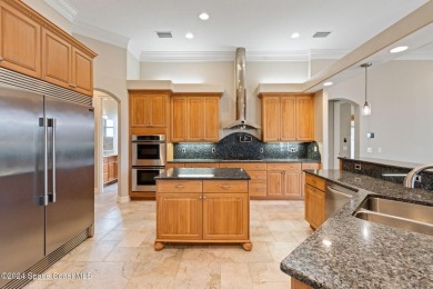 This stunning executive home exudes modern elegance and boasts on Baytree National Golf Links in Florida - for sale on GolfHomes.com, golf home, golf lot