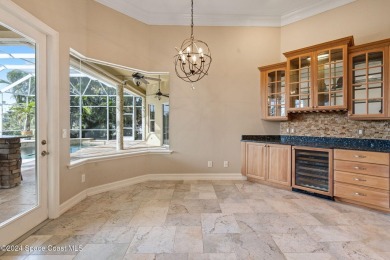 This stunning executive home exudes modern elegance and boasts on Baytree National Golf Links in Florida - for sale on GolfHomes.com, golf home, golf lot