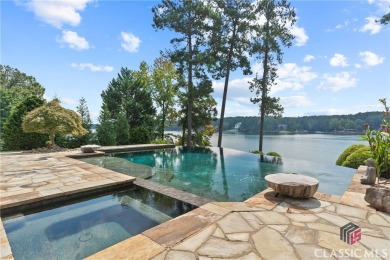 Discover luxurious lakefront living with this stunning custom on Reynolds Lake Oconee - The Oconee in Georgia - for sale on GolfHomes.com, golf home, golf lot