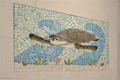 Morning light floods the beautiful window lined sunroom of this on Captiva Island Golf Club in Florida - for sale on GolfHomes.com, golf home, golf lot