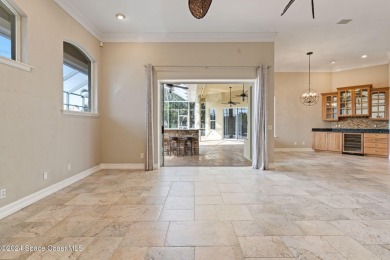 This stunning executive home exudes modern elegance and boasts on Baytree National Golf Links in Florida - for sale on GolfHomes.com, golf home, golf lot