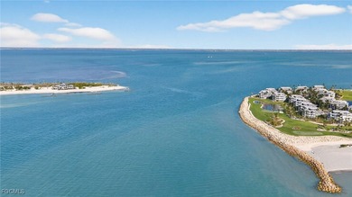 Morning light floods the beautiful window lined sunroom of this on Captiva Island Golf Club in Florida - for sale on GolfHomes.com, golf home, golf lot