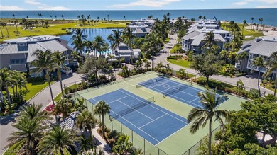 Morning light floods the beautiful window lined sunroom of this on Captiva Island Golf Club in Florida - for sale on GolfHomes.com, golf home, golf lot