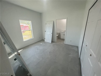 Welcome to this modern 2-bedroom, 1-bathroom new construction on River Hall Country Club in Florida - for sale on GolfHomes.com, golf home, golf lot