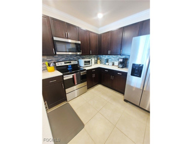 Welcome to your lakeview villa with attached garage. Storage on Herons Glen Golf and Country Club in Florida - for sale on GolfHomes.com, golf home, golf lot