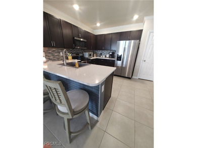 Welcome to your lakeview villa with attached garage. Storage on Herons Glen Golf and Country Club in Florida - for sale on GolfHomes.com, golf home, golf lot