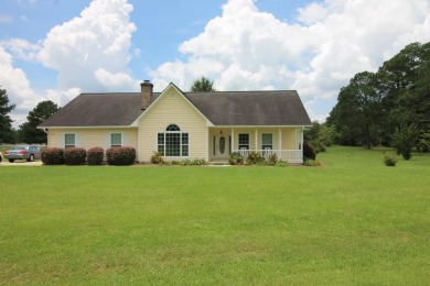 This 4 bed, 2 bath home features open floor plan with additional on Blueberry Plantation Golf and Country Club in Georgia - for sale on GolfHomes.com, golf home, golf lot