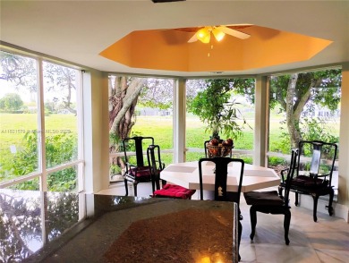 The moment you walk in, you feel it -- space, light, freedom. A on Woodlands Country Club in Florida - for sale on GolfHomes.com, golf home, golf lot