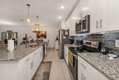 Feel right at home the moment you arrive at this bright and airy on Deep Creek Golf Club in Florida - for sale on GolfHomes.com, golf home, golf lot