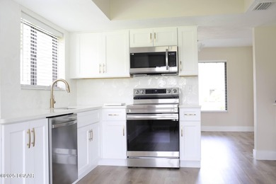 COMPLETELY RENOVATED Gated Golf Cmty - 3BR/2BA END UNIT | 128-B on The Club At Pelican Bay - North Course in Florida - for sale on GolfHomes.com, golf home, golf lot