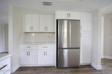 COMPLETELY RENOVATED Gated Golf Cmty - 3BR/2BA END UNIT | 128-B on The Club At Pelican Bay - North Course in Florida - for sale on GolfHomes.com, golf home, golf lot