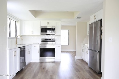 COMPLETELY RENOVATED Gated Golf Cmty - 3BR/2BA END UNIT | 128-B on The Club At Pelican Bay - North Course in Florida - for sale on GolfHomes.com, golf home, golf lot