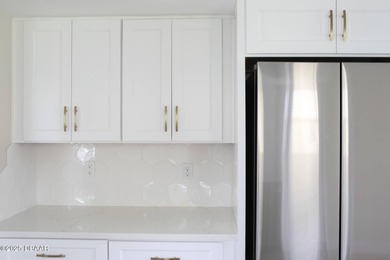 COMPLETELY RENOVATED Gated Golf Cmty - 3BR/2BA END UNIT | 128-B on The Club At Pelican Bay - North Course in Florida - for sale on GolfHomes.com, golf home, golf lot