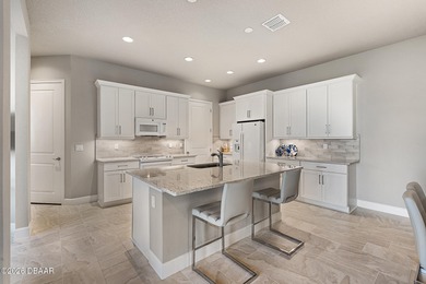 Newly designed Arbor III townhome with a desirable side entrance on Plantation Bay Golf and Country Club in Florida - for sale on GolfHomes.com, golf home, golf lot