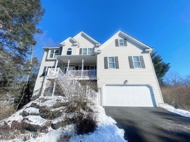 This MAJESTIC home with STUNNING views offers 5 bedrooms, 4 on Country Club of the Poconos Golf Course in Pennsylvania - for sale on GolfHomes.com, golf home, golf lot