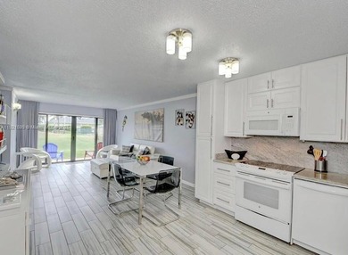 Beautiful totally renovated corner unit1 bedroom 1 bath, first on Ocean Village Golf Course in Florida - for sale on GolfHomes.com, golf home, golf lot