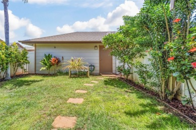 Discover comfort and convenience in this single-level end unit on Hoakalei Country Club At Ocean Pointe in Hawaii - for sale on GolfHomes.com, golf home, golf lot