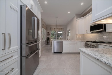 Halifax Plantation pool home. Immaculately maintained. Built by on Halifax Plantation Golf Club in Florida - for sale on GolfHomes.com, golf home, golf lot