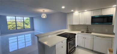 Spacious Remodel VERY BRIGHT Golf and Pool view Partial Impact on Palm-Aire Country Club and Resort - The Oaks in Florida - for sale on GolfHomes.com, golf home, golf lot