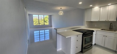 Spacious Remodel VERY BRIGHT Golf and Pool view Partial Impact on Palm-Aire Country Club and Resort - The Oaks in Florida - for sale on GolfHomes.com, golf home, golf lot