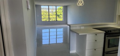 Spacious Remodel VERY BRIGHT Golf and Pool view Partial Impact on Palm-Aire Country Club and Resort - The Oaks in Florida - for sale on GolfHomes.com, golf home, golf lot