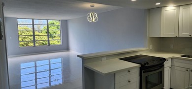 Spacious Remodel VERY BRIGHT Golf and Pool view Partial Impact on Palm-Aire Country Club and Resort - The Oaks in Florida - for sale on GolfHomes.com, golf home, golf lot