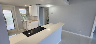 Spacious Remodel VERY BRIGHT Golf and Pool view Partial Impact on Palm-Aire Country Club and Resort - The Oaks in Florida - for sale on GolfHomes.com, golf home, golf lot