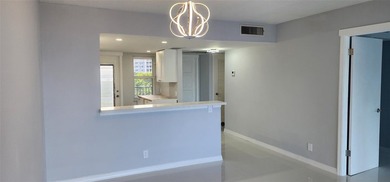 Spacious Remodel VERY BRIGHT Golf and Pool view Partial Impact on Palm-Aire Country Club and Resort - The Oaks in Florida - for sale on GolfHomes.com, golf home, golf lot