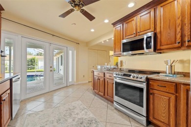 This spacious 4-bedroom, 3-bath POOL home is located in the on Mangrove Bay Golf Course in Florida - for sale on GolfHomes.com, golf home, golf lot