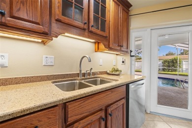 This spacious 4-bedroom, 3-bath POOL home is located in the on Mangrove Bay Golf Course in Florida - for sale on GolfHomes.com, golf home, golf lot