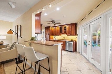 This spacious 4-bedroom, 3-bath POOL home is located in the on Mangrove Bay Golf Course in Florida - for sale on GolfHomes.com, golf home, golf lot