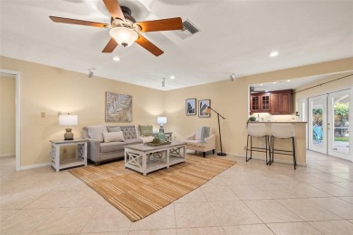This spacious 4-bedroom, 3-bath POOL home is located in the on Mangrove Bay Golf Course in Florida - for sale on GolfHomes.com, golf home, golf lot