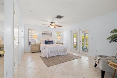 This spacious 4-bedroom, 3-bath POOL home is located in the on Mangrove Bay Golf Course in Florida - for sale on GolfHomes.com, golf home, golf lot