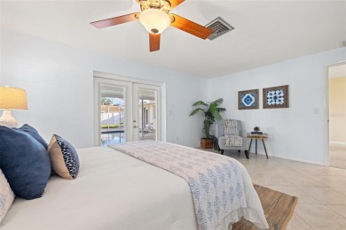 This spacious 4-bedroom, 3-bath POOL home is located in the on Mangrove Bay Golf Course in Florida - for sale on GolfHomes.com, golf home, golf lot