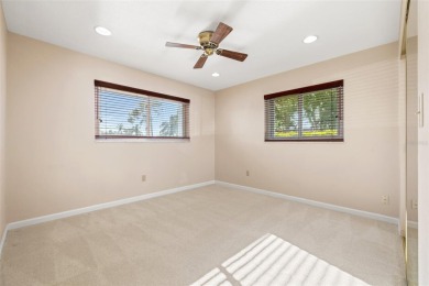 This spacious 4-bedroom, 3-bath POOL home is located in the on Mangrove Bay Golf Course in Florida - for sale on GolfHomes.com, golf home, golf lot
