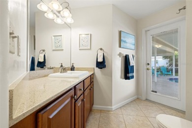 This spacious 4-bedroom, 3-bath POOL home is located in the on Mangrove Bay Golf Course in Florida - for sale on GolfHomes.com, golf home, golf lot