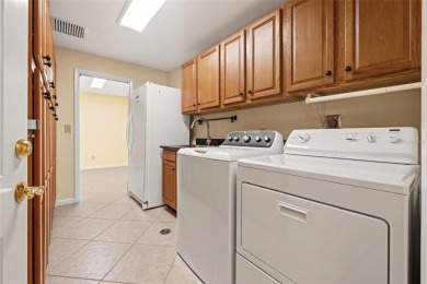 This spacious 4-bedroom, 3-bath POOL home is located in the on Mangrove Bay Golf Course in Florida - for sale on GolfHomes.com, golf home, golf lot